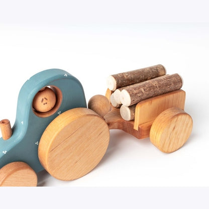 Traktorius su rąstais